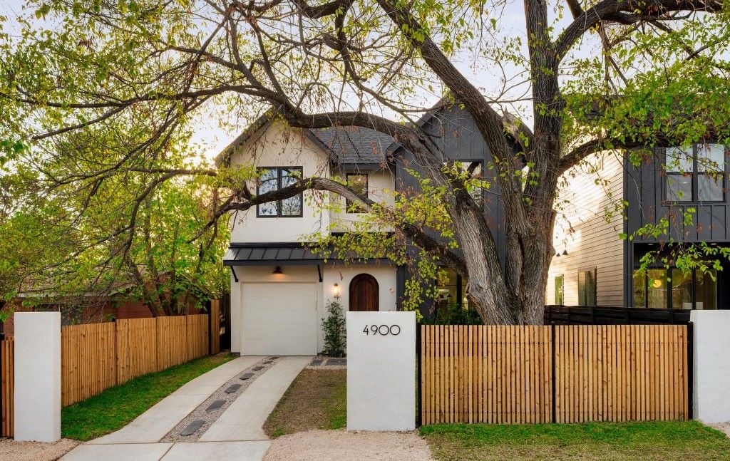 Street view of 4900 Majestic with address pillar, mature tree, and modern fencing